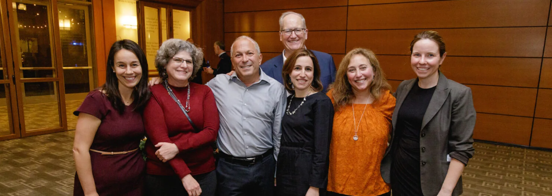 Harvard Law School Clinical Professor Robert Greenwald, (center, with from left) Meredith Boak, assistant dean for clinical and experiential education and pro bono programs; Jean Terranova, senior director of policy & research, Community Servings; David Waters, CEO, Community Servings; Clinical Professor Emily Broad Lieb ’08, Amy Rosenfeld, former associate director of the Health Law and Policy Clinic, and Clinical instructor Katie Garfield, director of whole person care, Center for Health Law and Policy Innovation