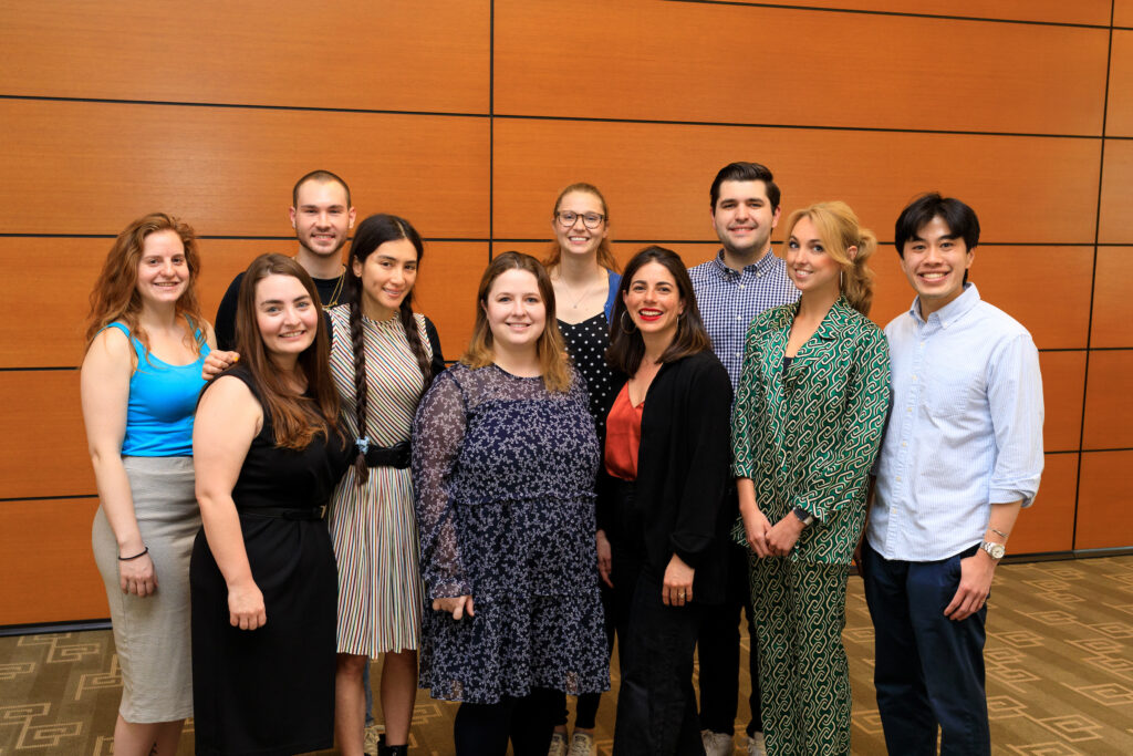 The graduating class of fellows poses for a photo in Milstein East